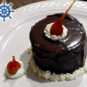 Bourbon Chocolate Cake with marscapone, dark chocolate ganache and candied hazelnuts.